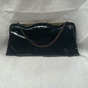 Vintage black patent vinyl clutch purse.